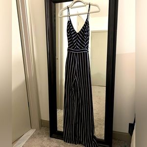 Navy striped Lush brand size medium jumpsuit with leg slit